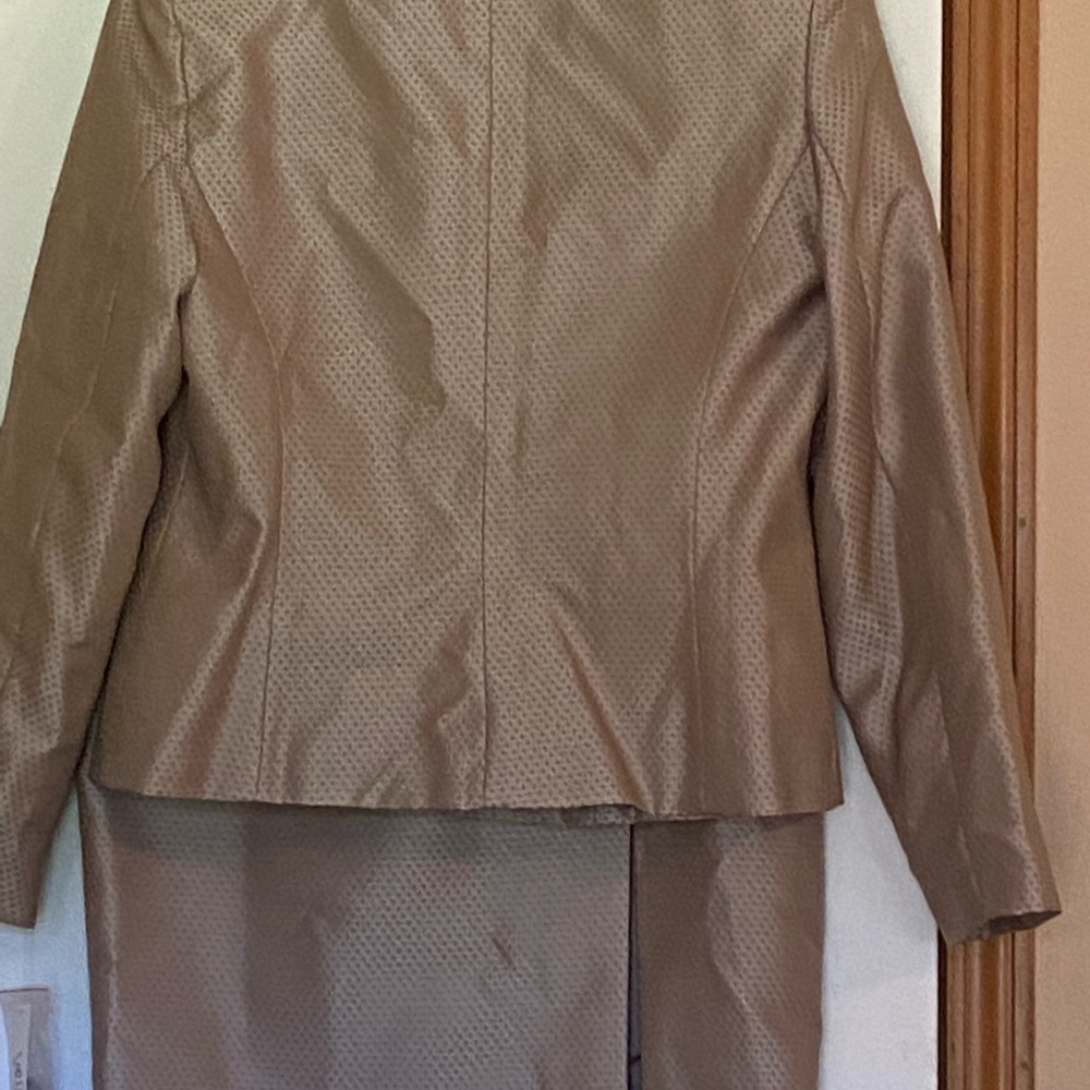 Tan skirt suit tags on